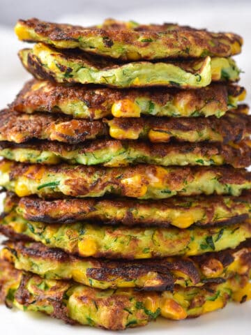 A tall stack of zucchini and corn fritters.