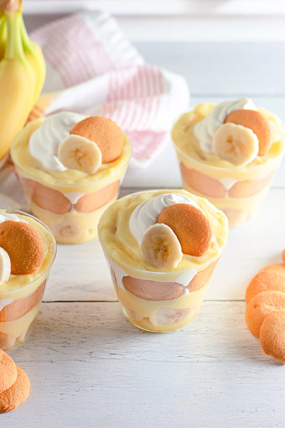 Rows of banana pudding cups on a table.