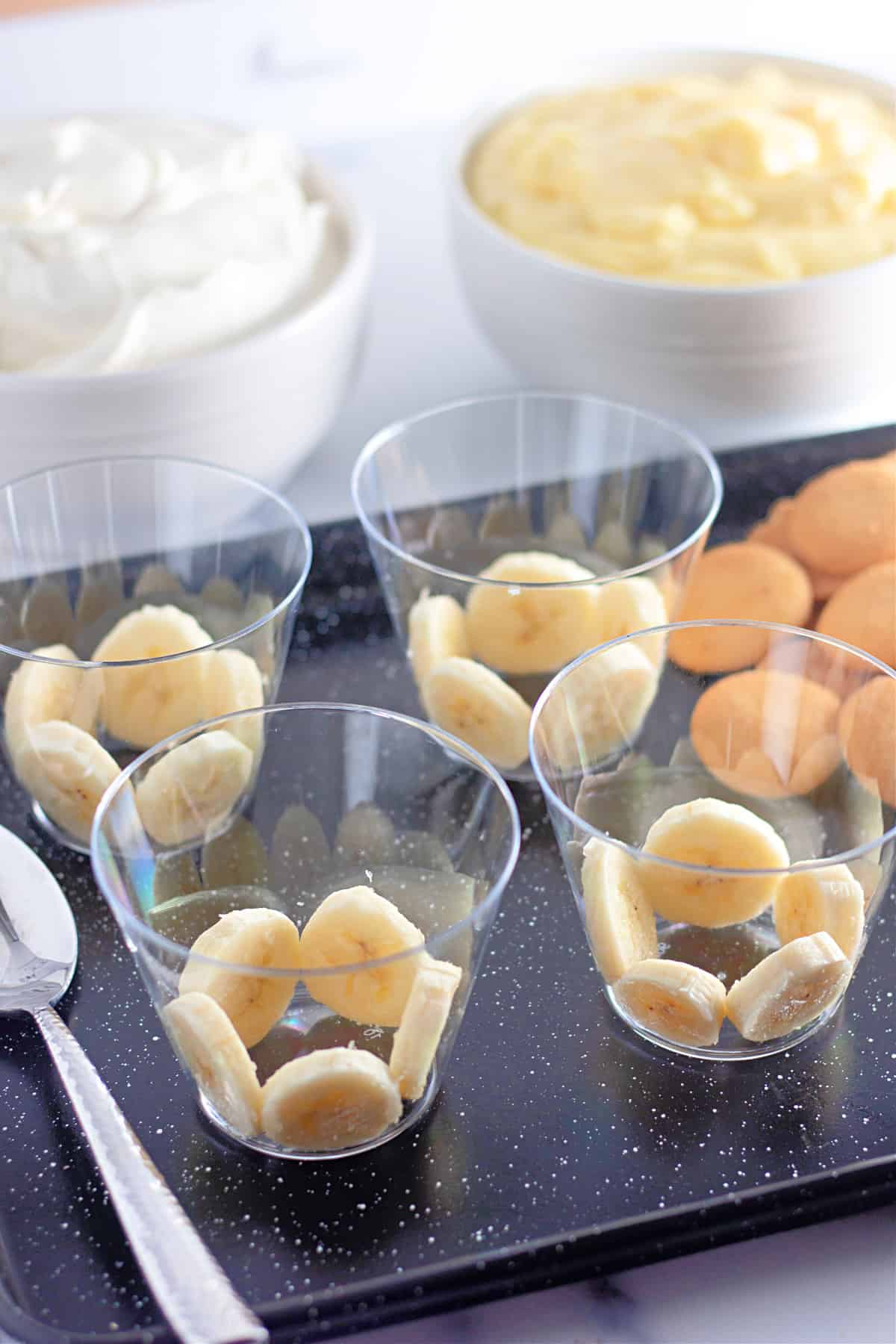 Cups with slices of banana.