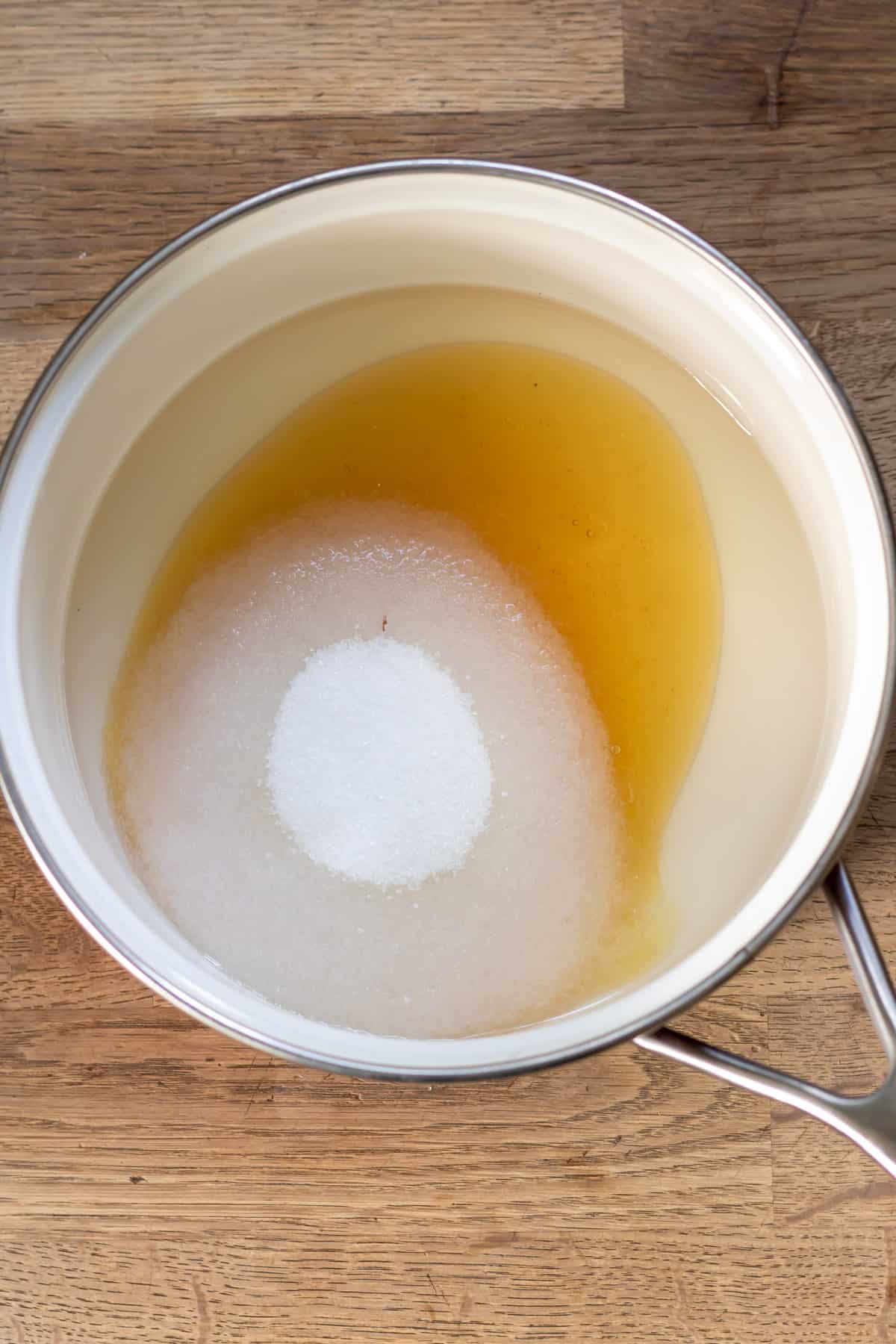 Water, sugar, honey, lemon juice and vanilla in a pot.