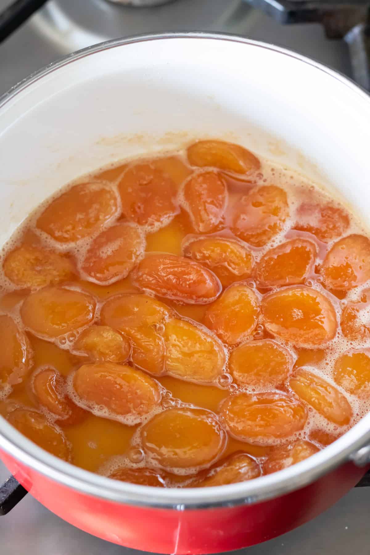 Simmering apricots.