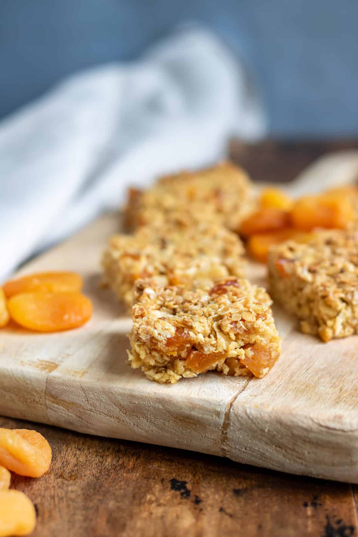 Side view of a slice of apricot flapjack oat bars.