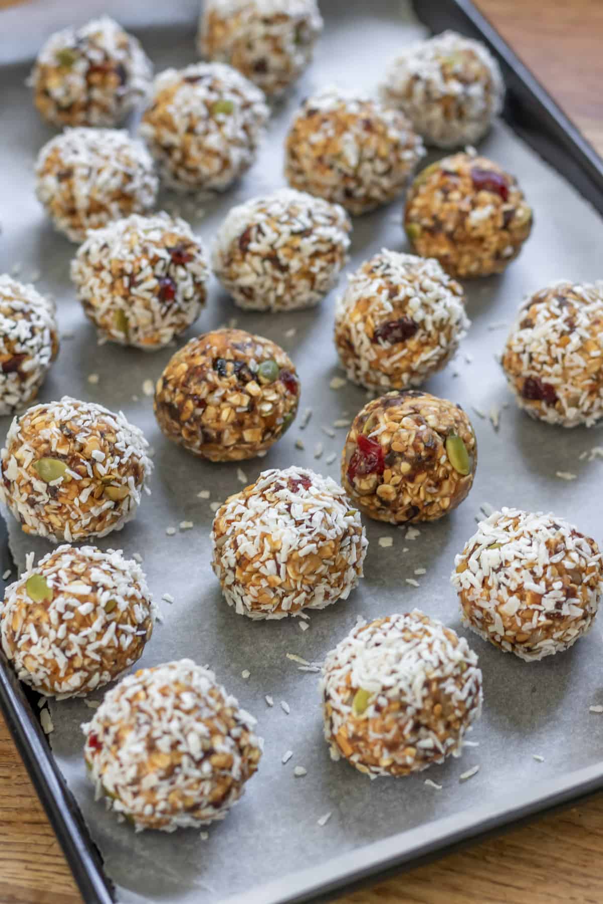 Rolled balls on a cookie sheet.