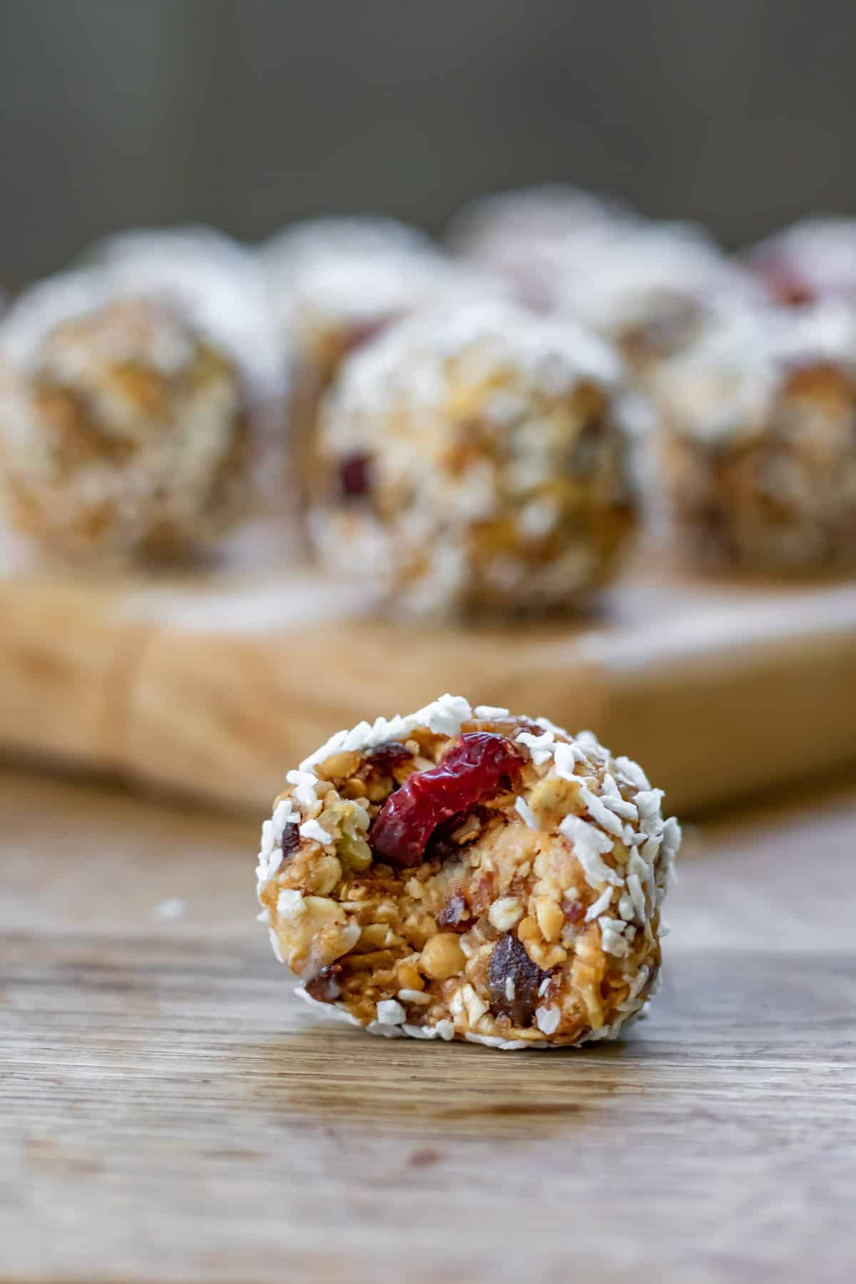 Date protein balls with one in front with a bite out.