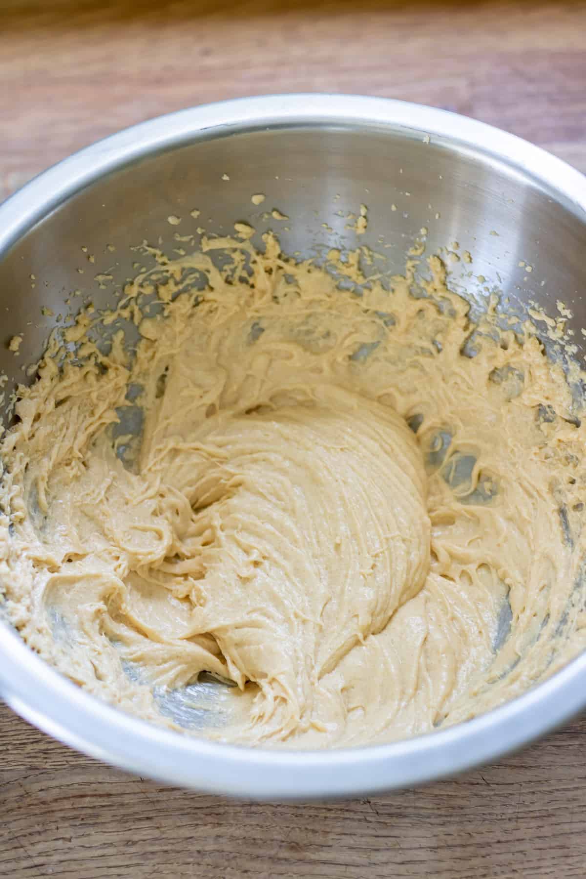 Mixing the egg and vanilla into the batter.