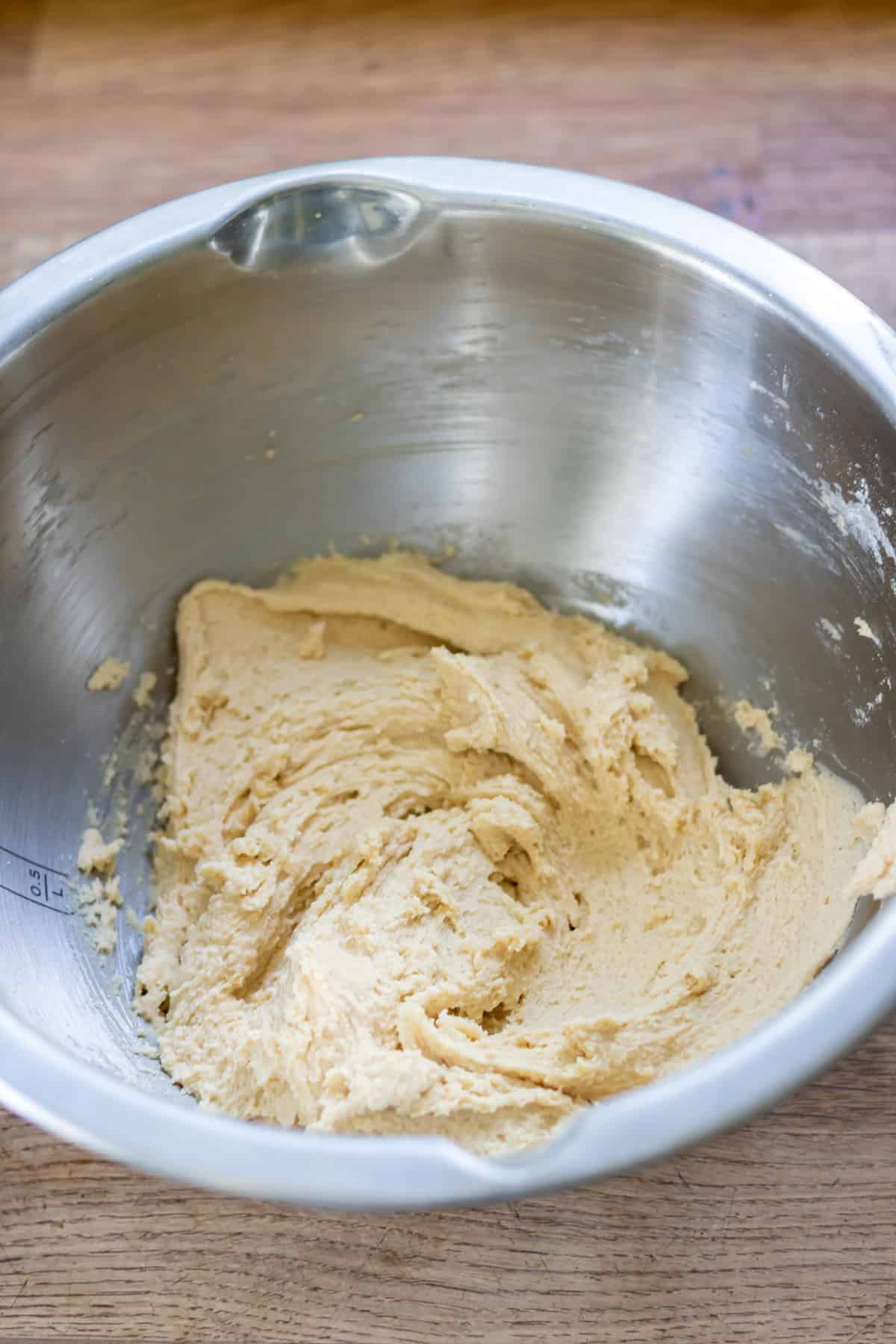 Mixing the flour into the batter.