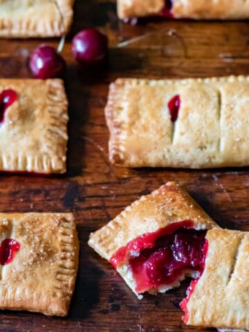 Close up of a cherry hand pie on a table.