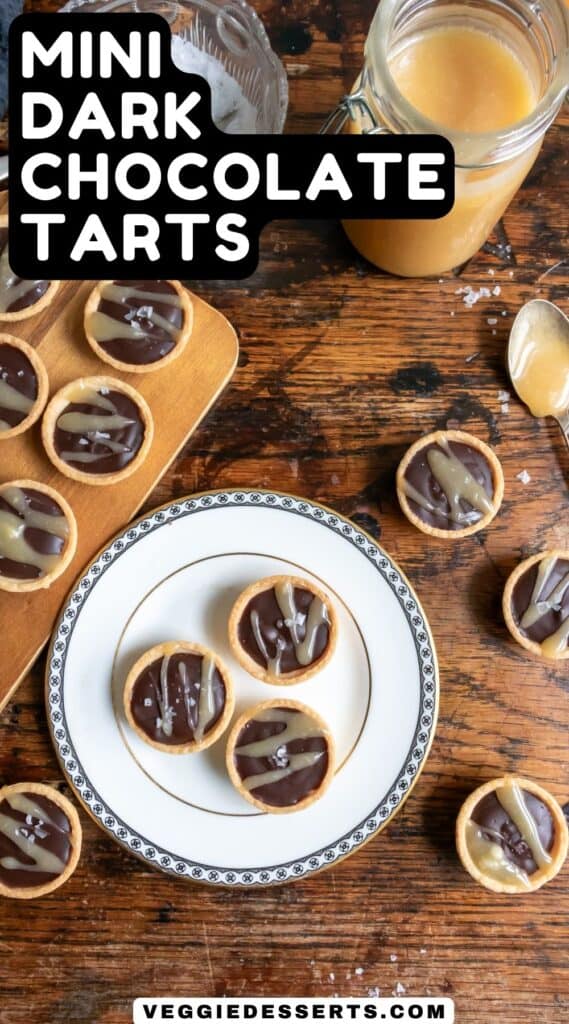 Little chocolate tarts on a table and plate, with text: Mini Dark Chocolate Tarts.