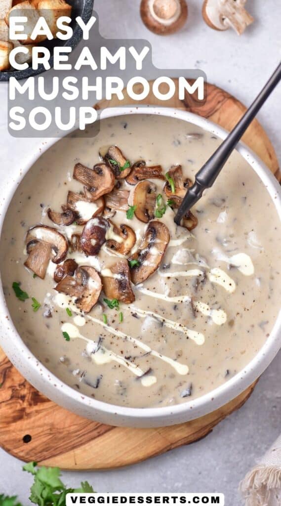 Bowl of soup with a spoon, with title: Easy Creamy Mushroom Soup.