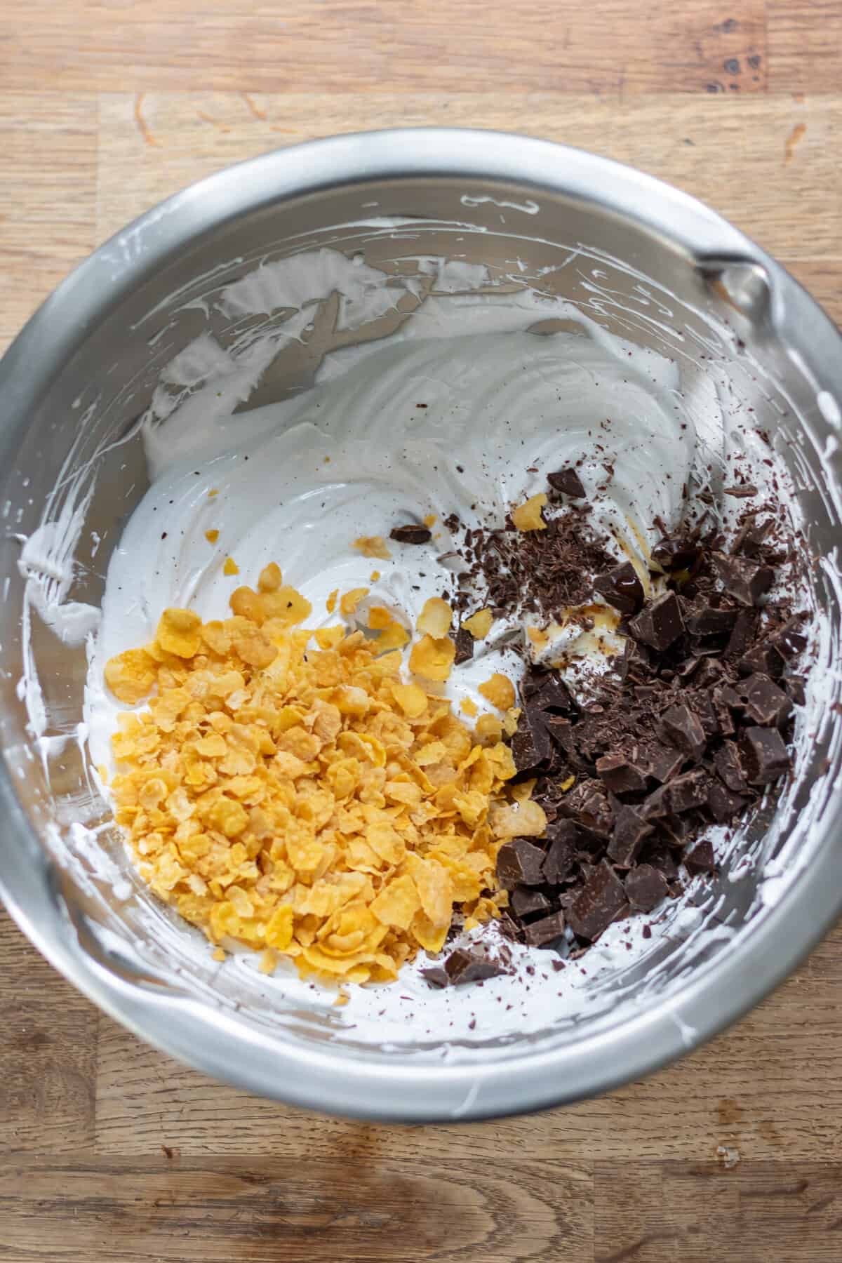 Cornflakes and chopped dark chocolate added to the meringue mixture.