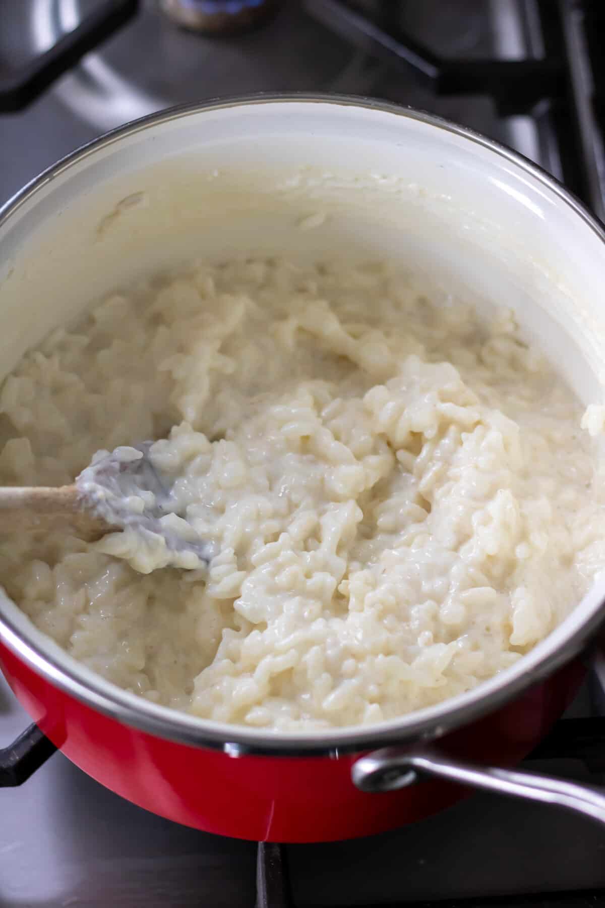 Stirring the risengrod rice porridge.