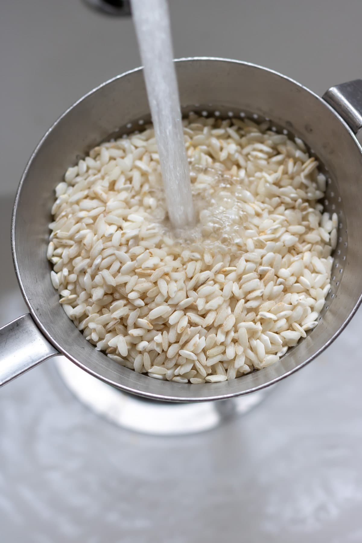 Rinsing the short grain arborio rice.