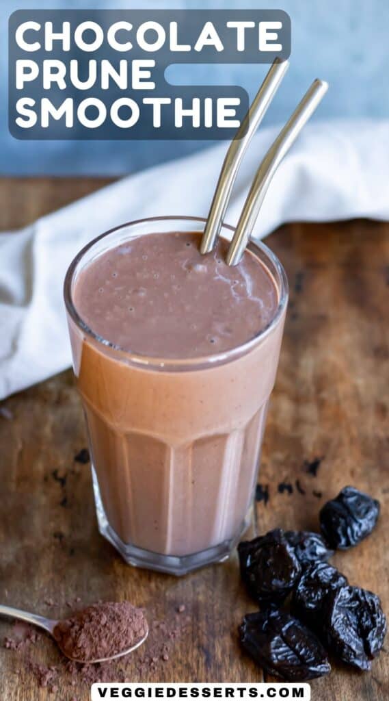 Glass of smoothie on a table with text: chocolate prune smoothie.