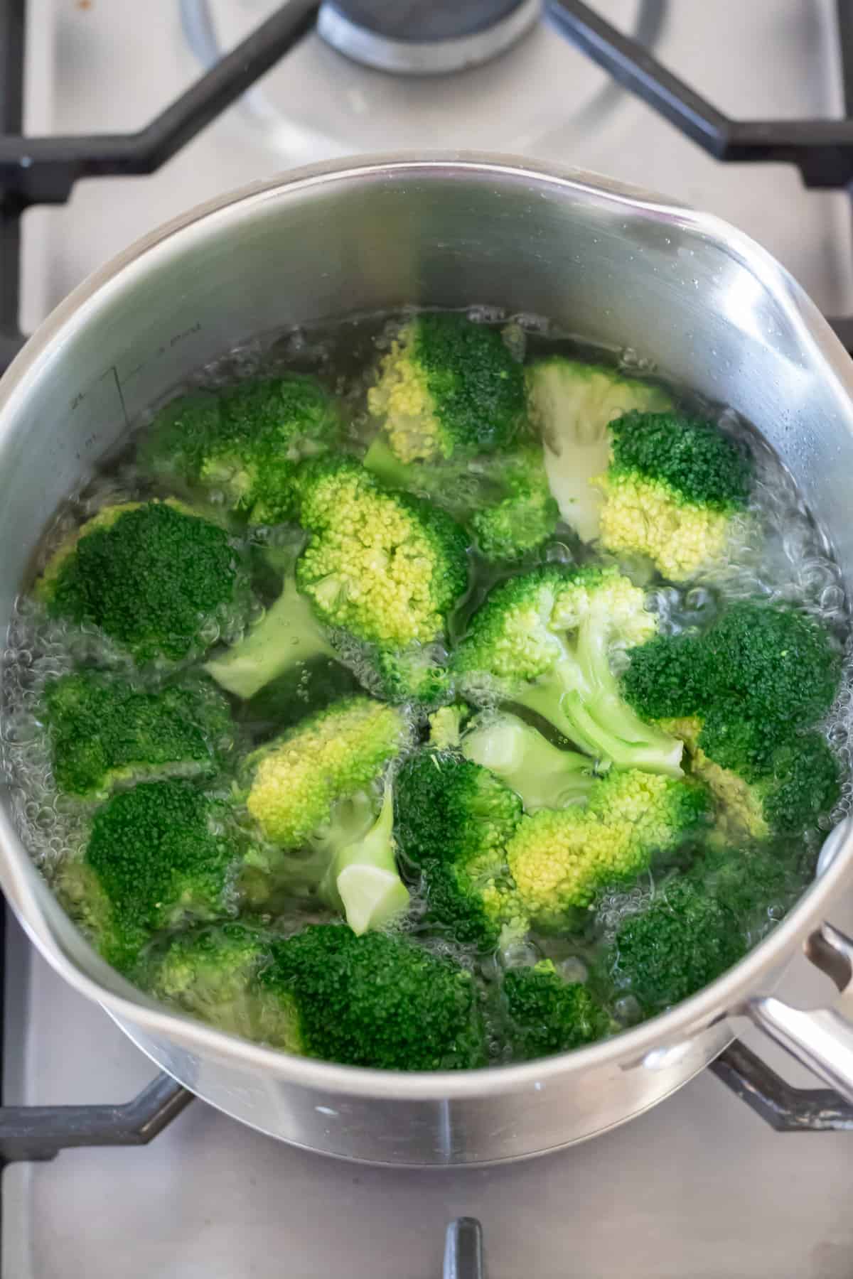 Boiling the broccoli florets.