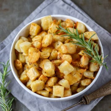 Looking down at a bowl of cubed crispy Parmentier Potatoes.