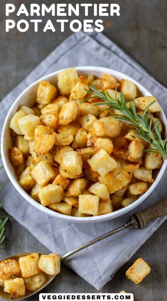 Bowl of cubed crispy potatoes, with text: Parmentier Potatoes.