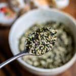 Close up of a spoonful of furikake - Japanese sesame seasoning.