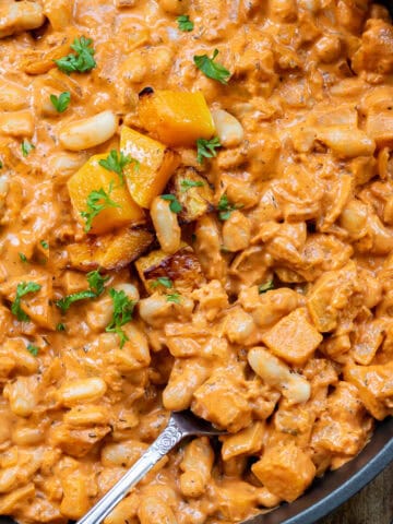 Spoon in a serving dish of creamy butternut beans.