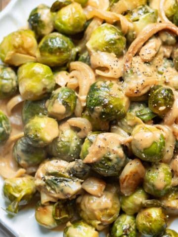 Looking down at a plate of creamy miso brussels sprouts.