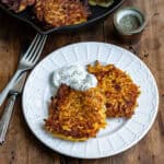 Side view of a plate with butternut squash fritters.