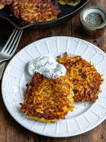 Side view of a plate with butternut squash fritters.