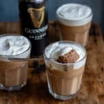 A spoonful resting on a glass of Guinness chocolate mousse.