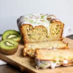 Side view of the sliced kiwi cake with lime drizzle.