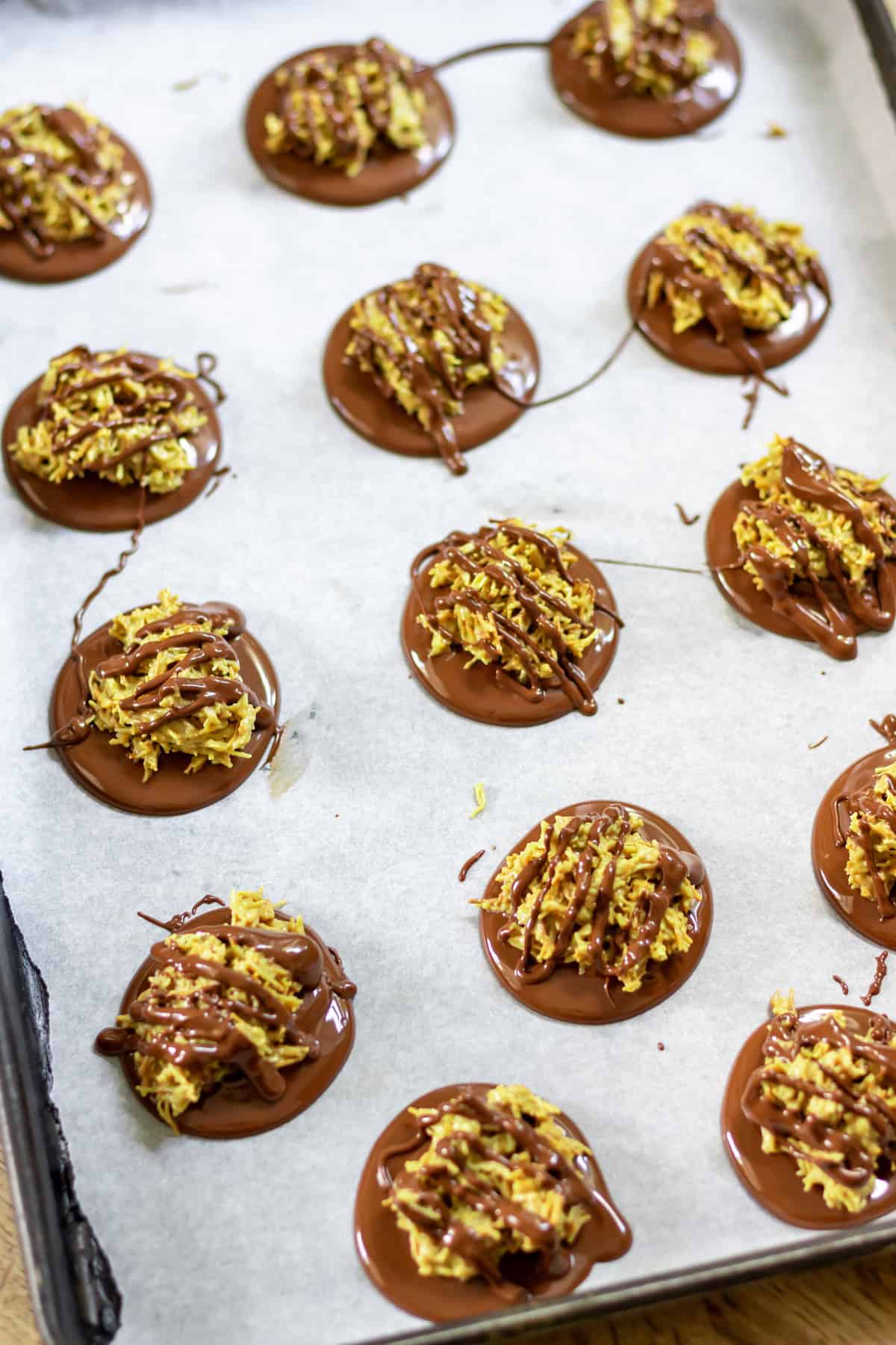 Drizzling melted chocolate on top of the Dubai chocolate bites.