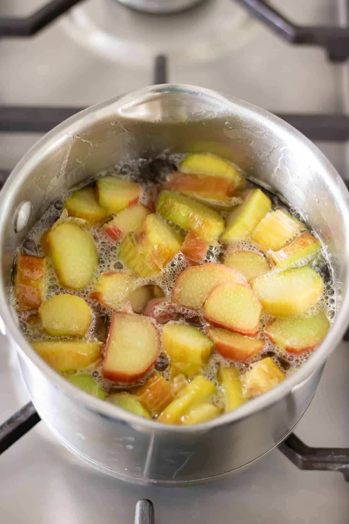 Simmering rhubarb syrup.