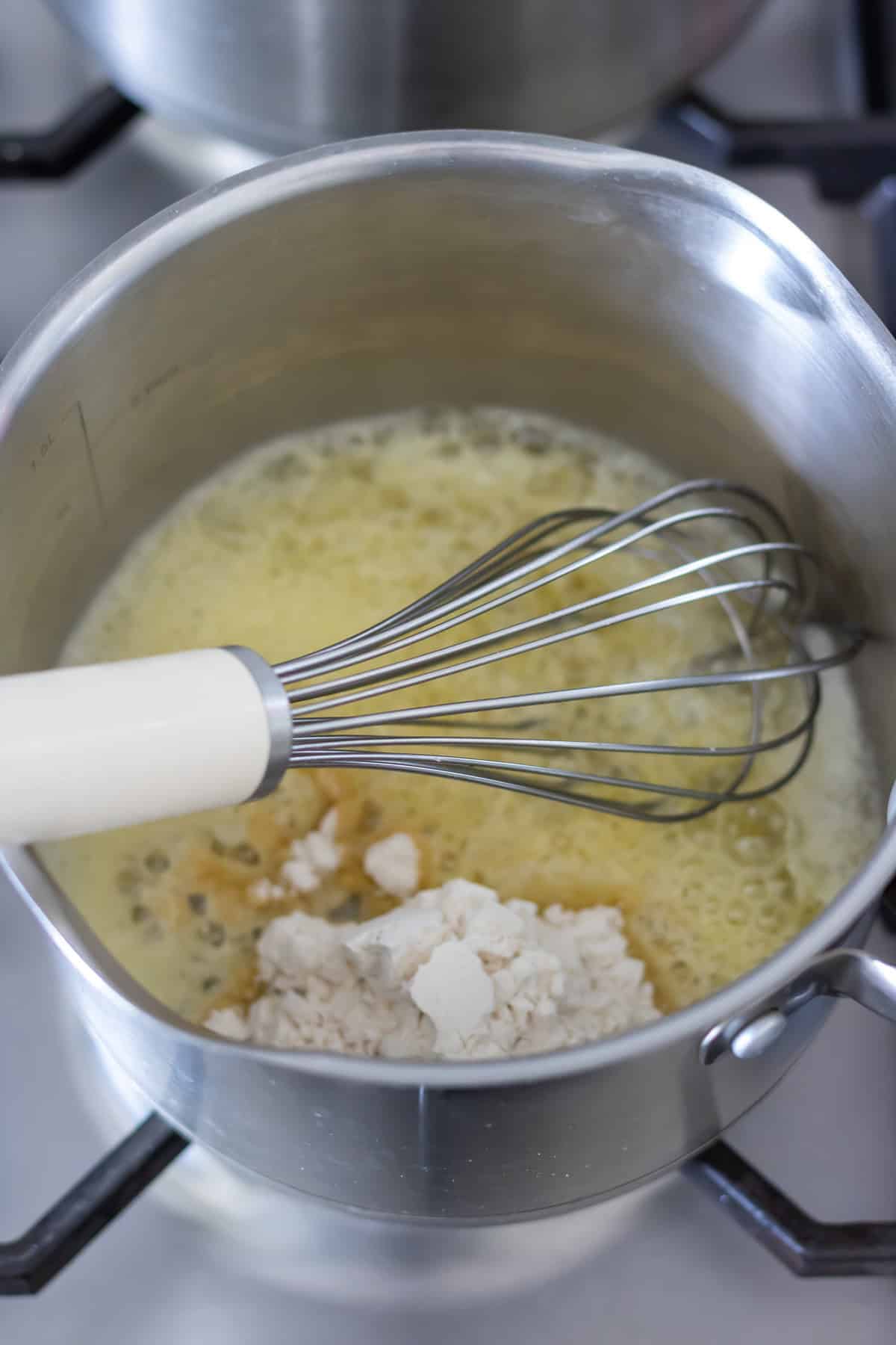 Whisking in the flour.