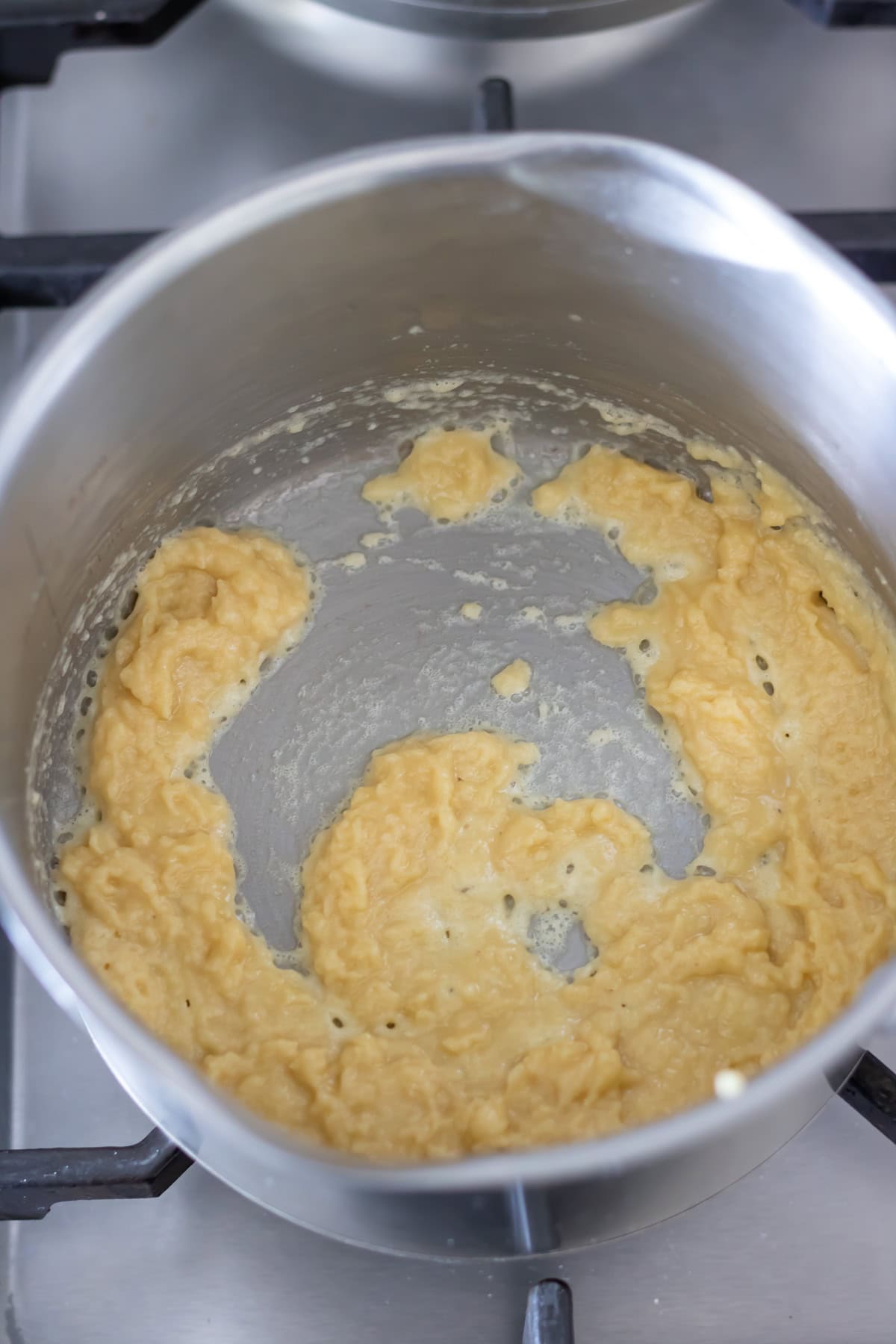 Cooking the flour into the roux.