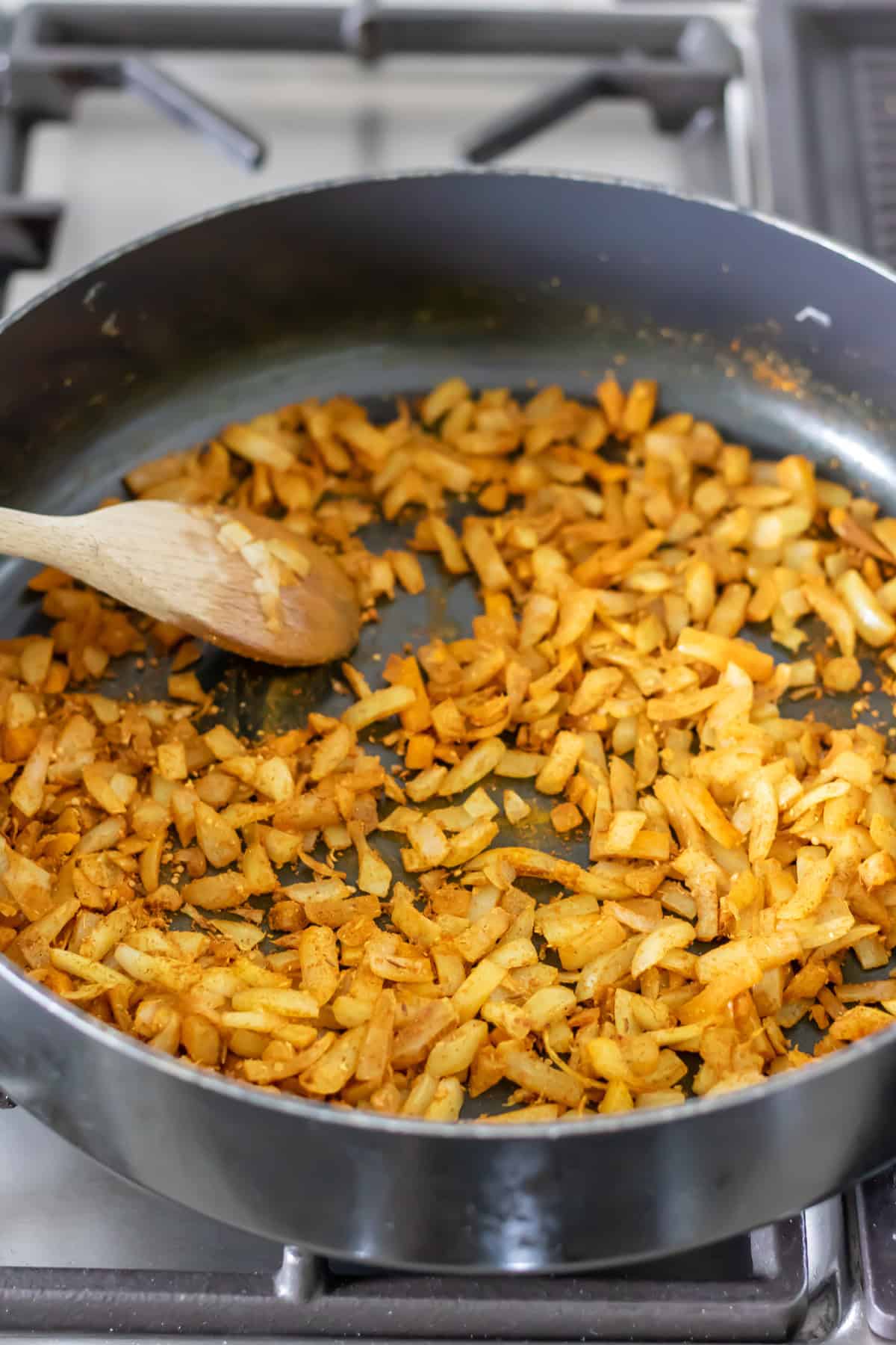 Spices stirred into the cooked onions.