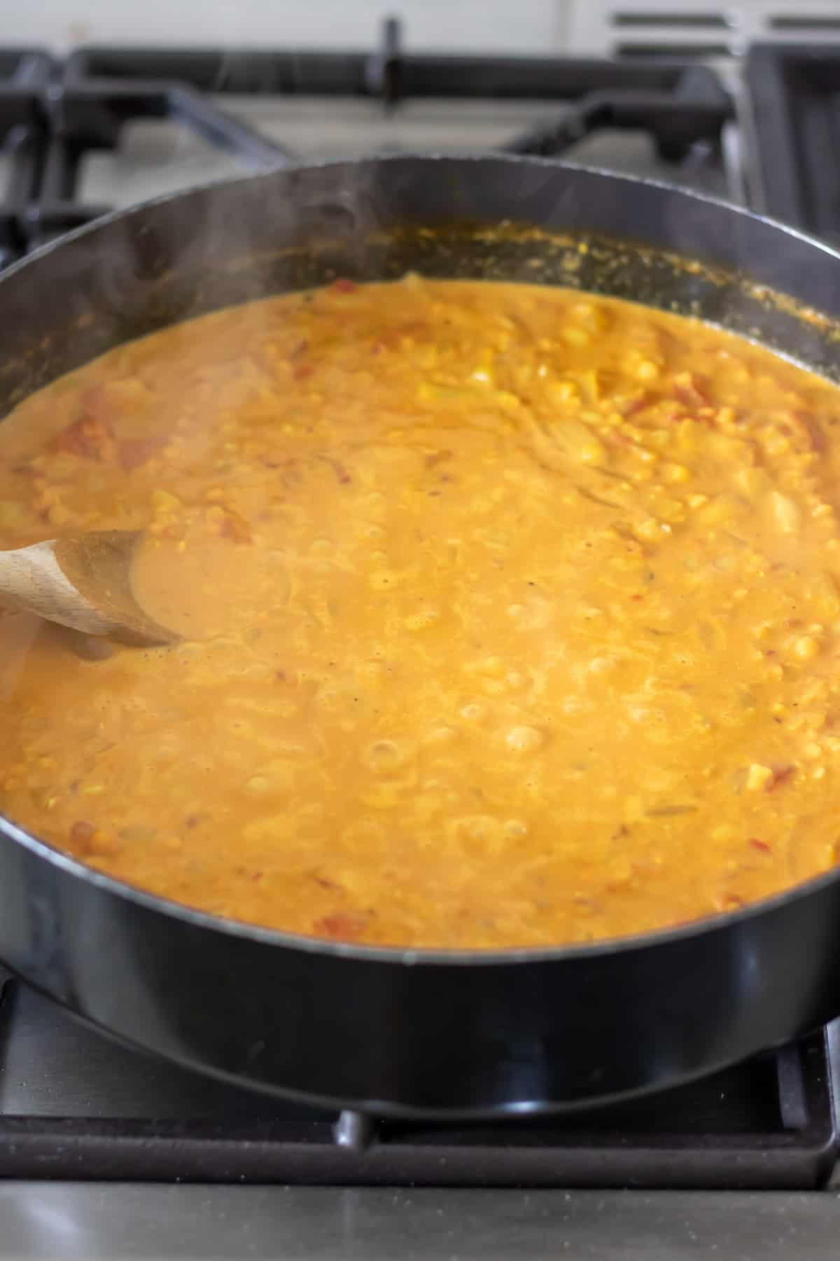 The lentil dahl simmering in the pan.