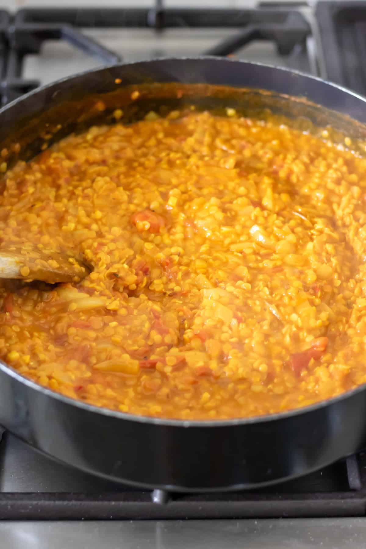 Cooked red lentil dhal.