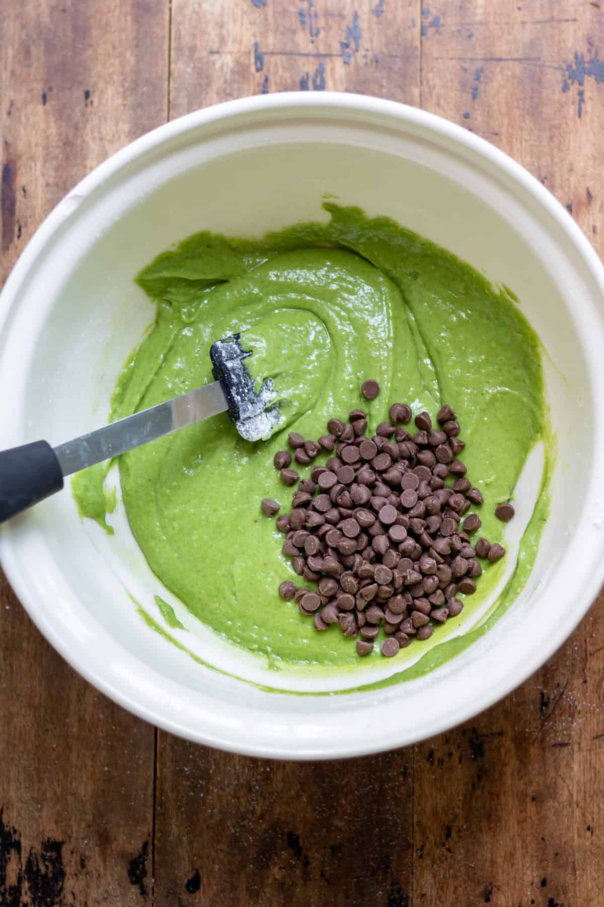 Stirring in the chocolate chips.