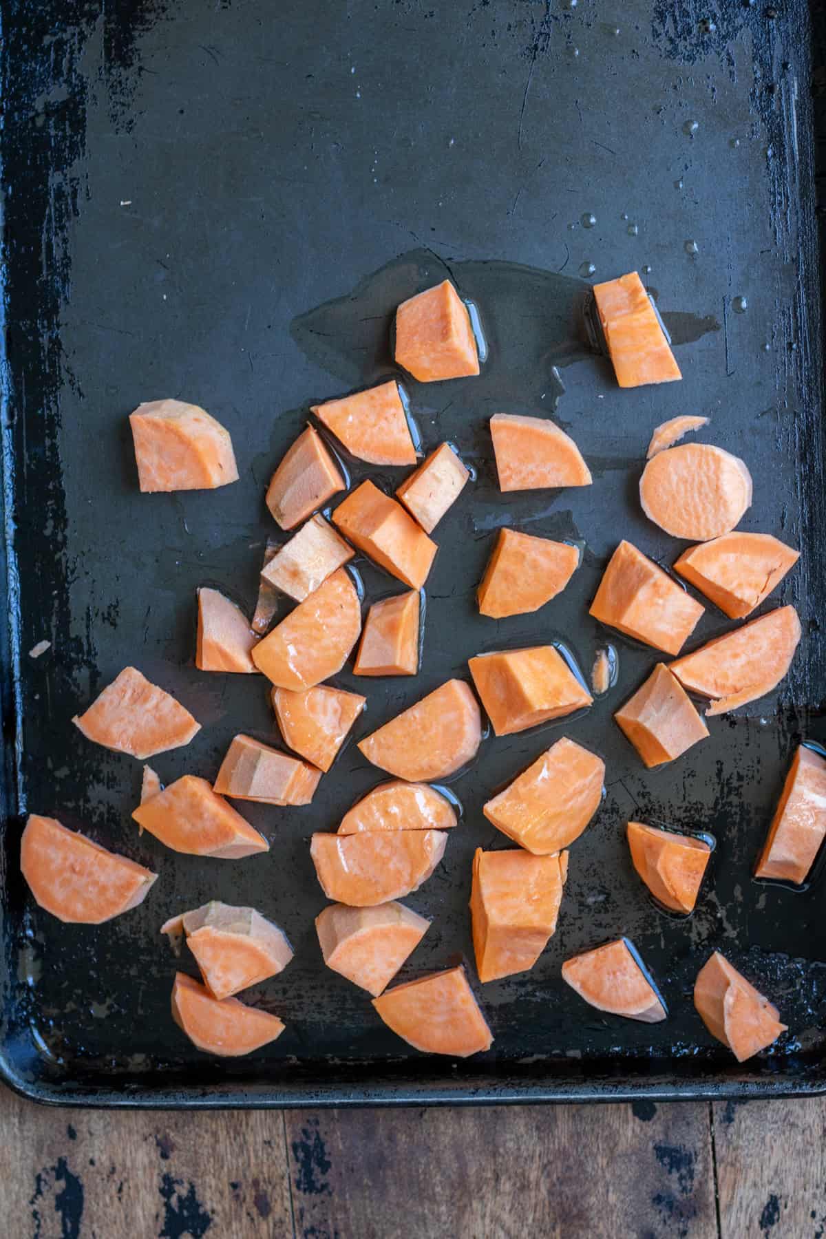 Chopped sweet potatoes on a baking sheet.