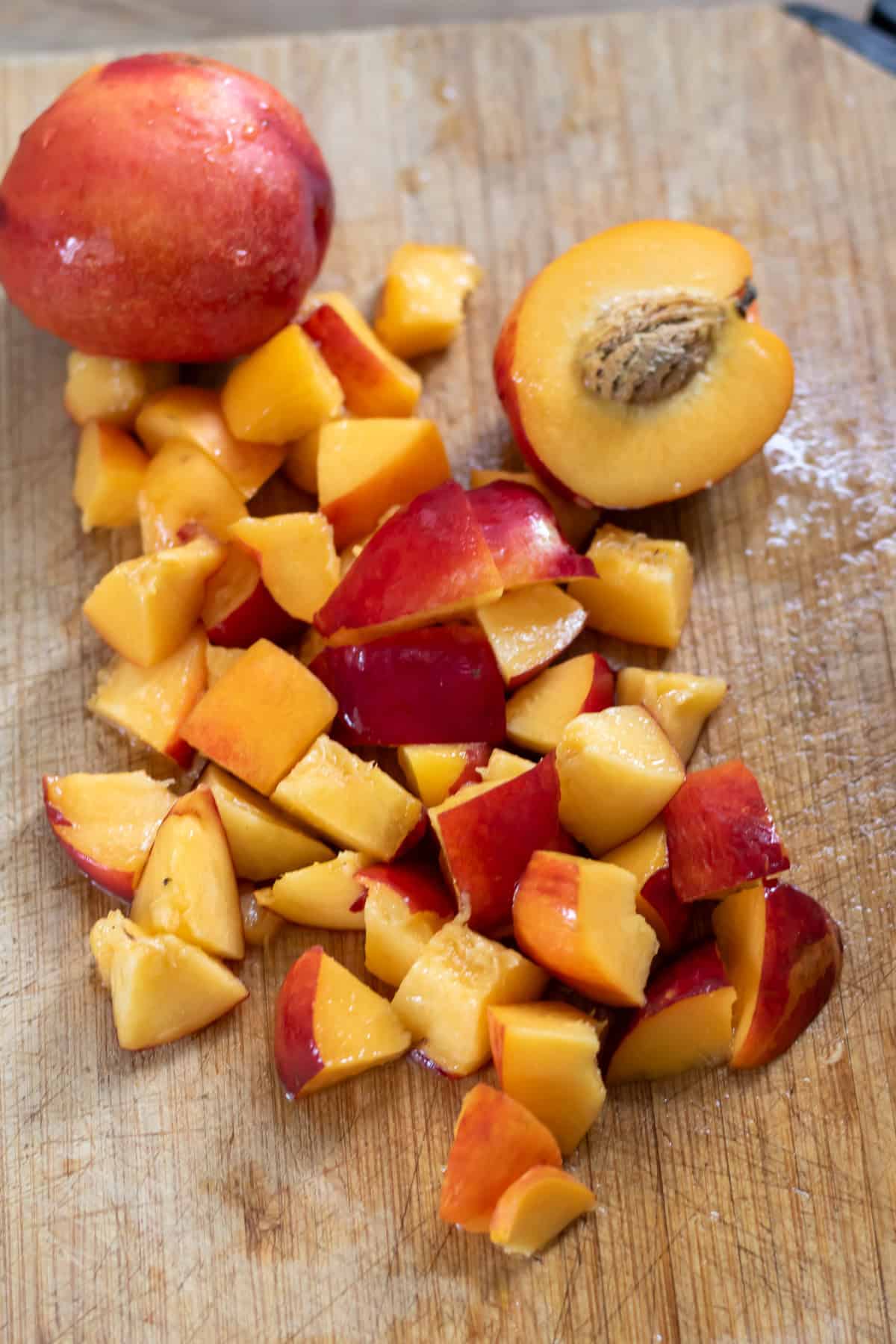 Chopping fresh ripe nectarines.