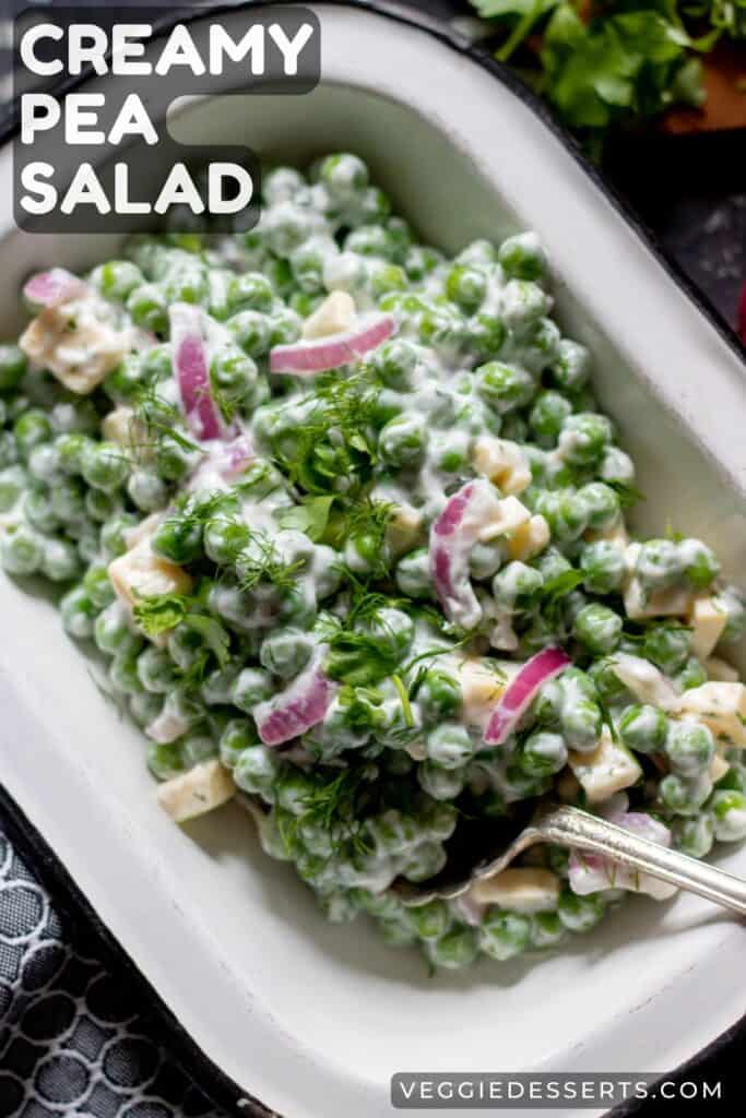 Bowl of salad, with text: Creamy Pea Salad.