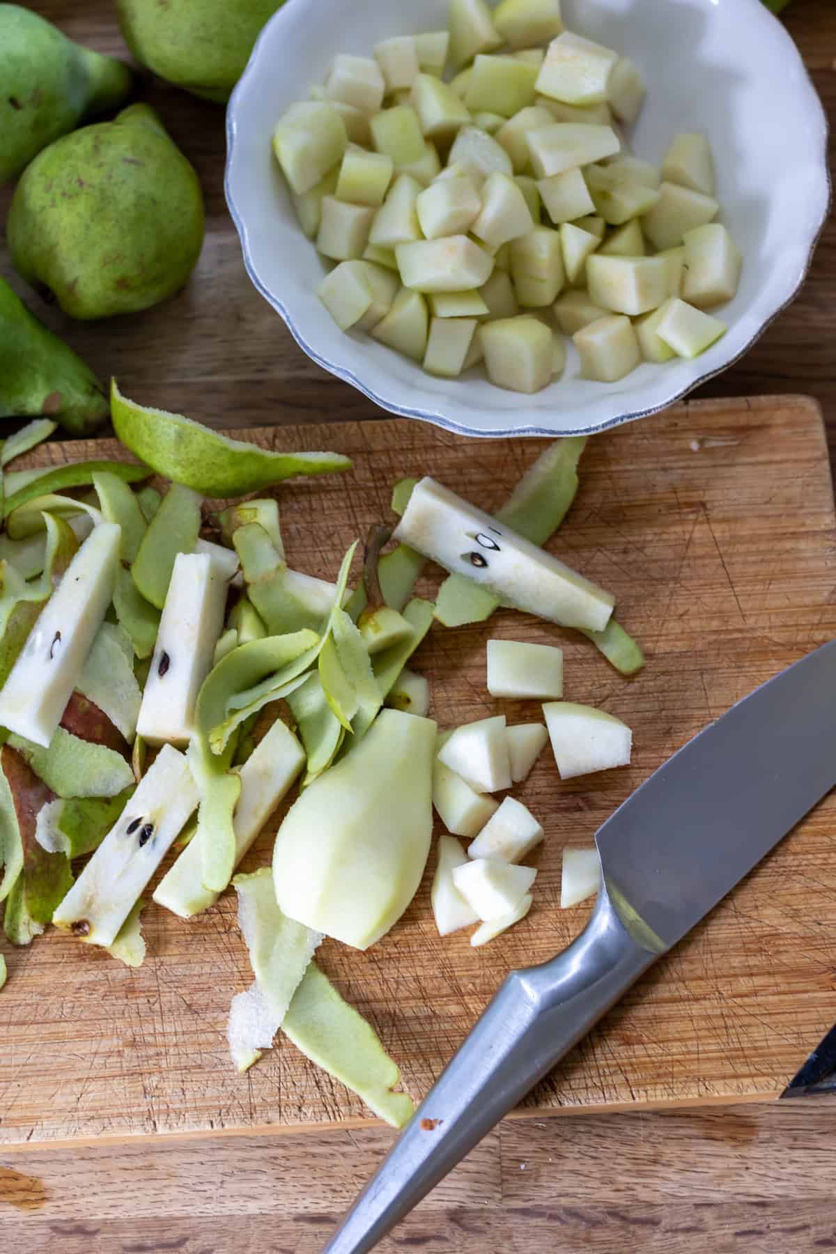 Chopping pears into cubes.