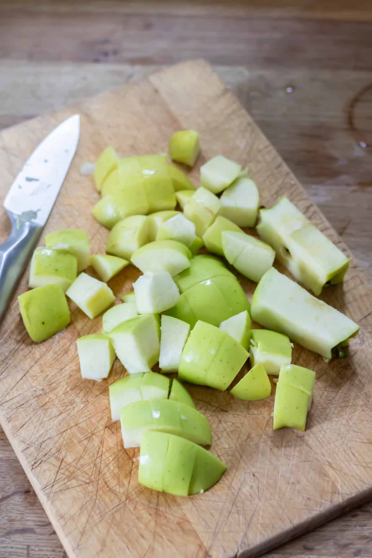 Chopping cored apples.