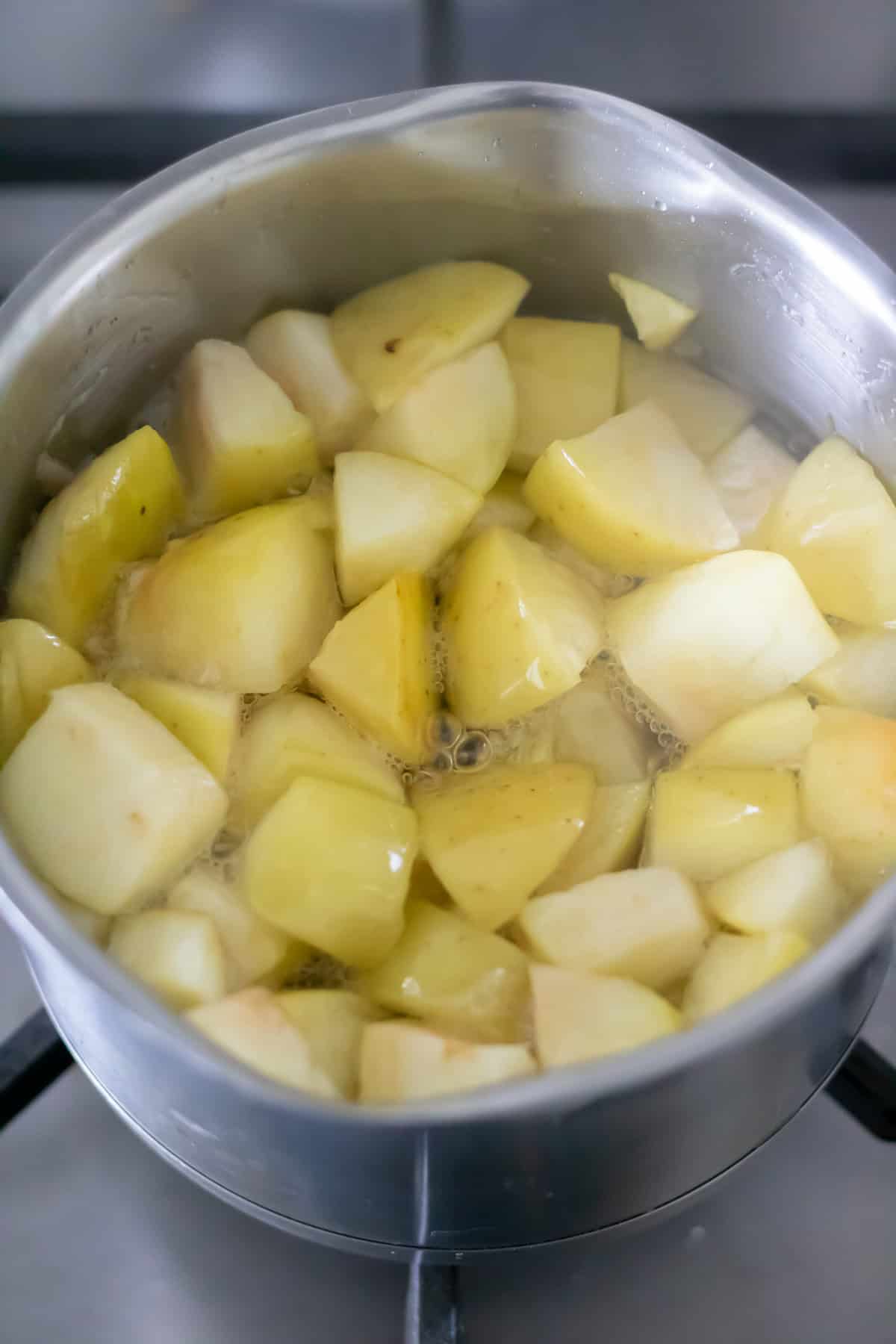 Simmered apple syrup in the saucepan.