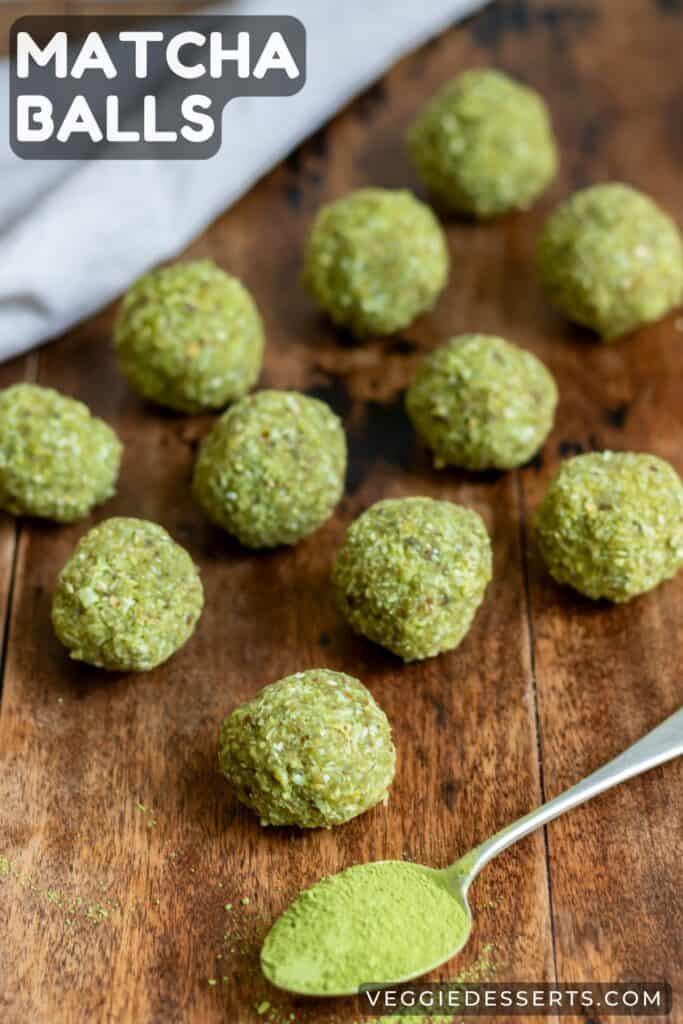 Energy bites on a table with text: Matcha Balls.