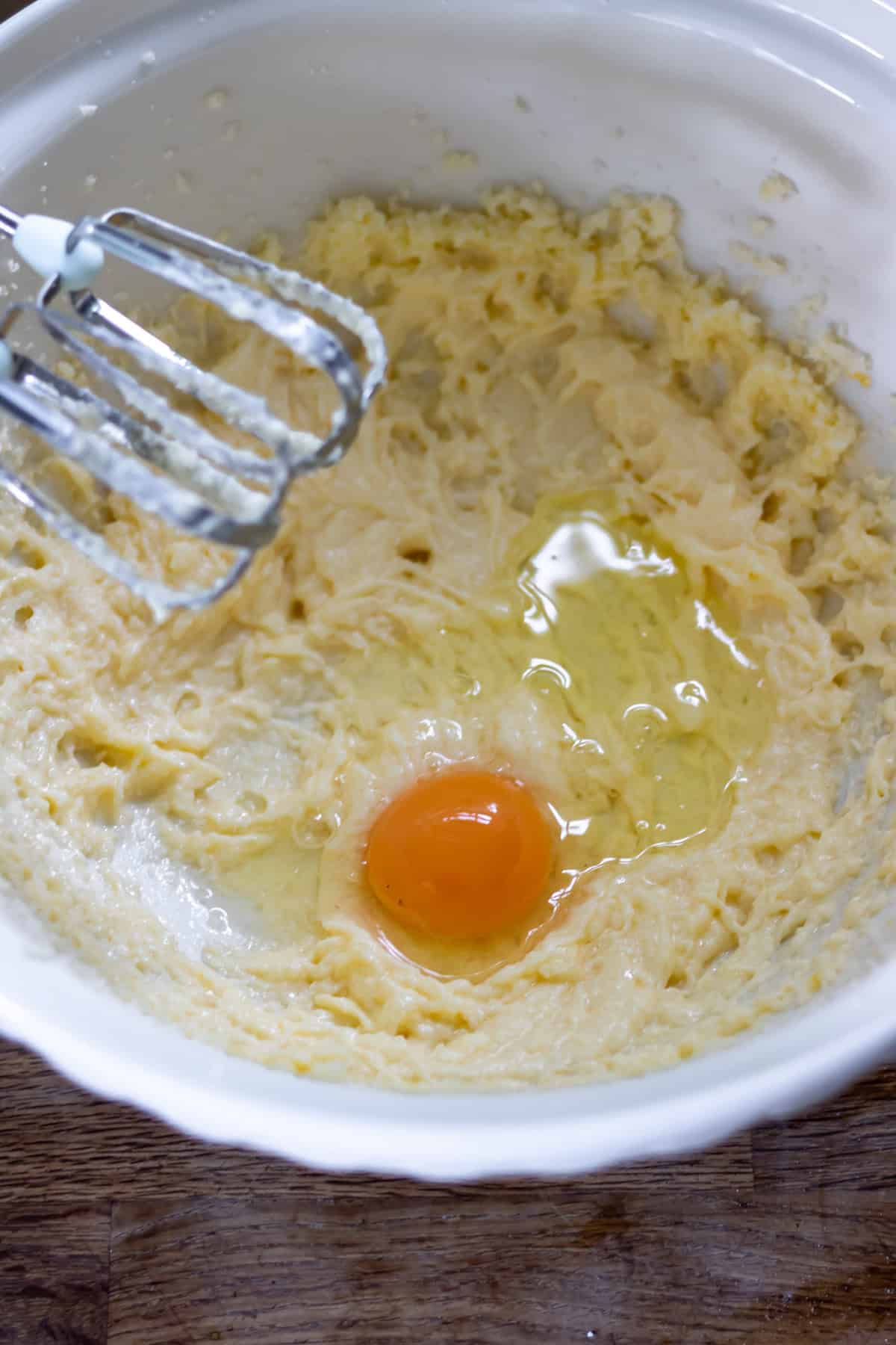 Mixing in the eggs.