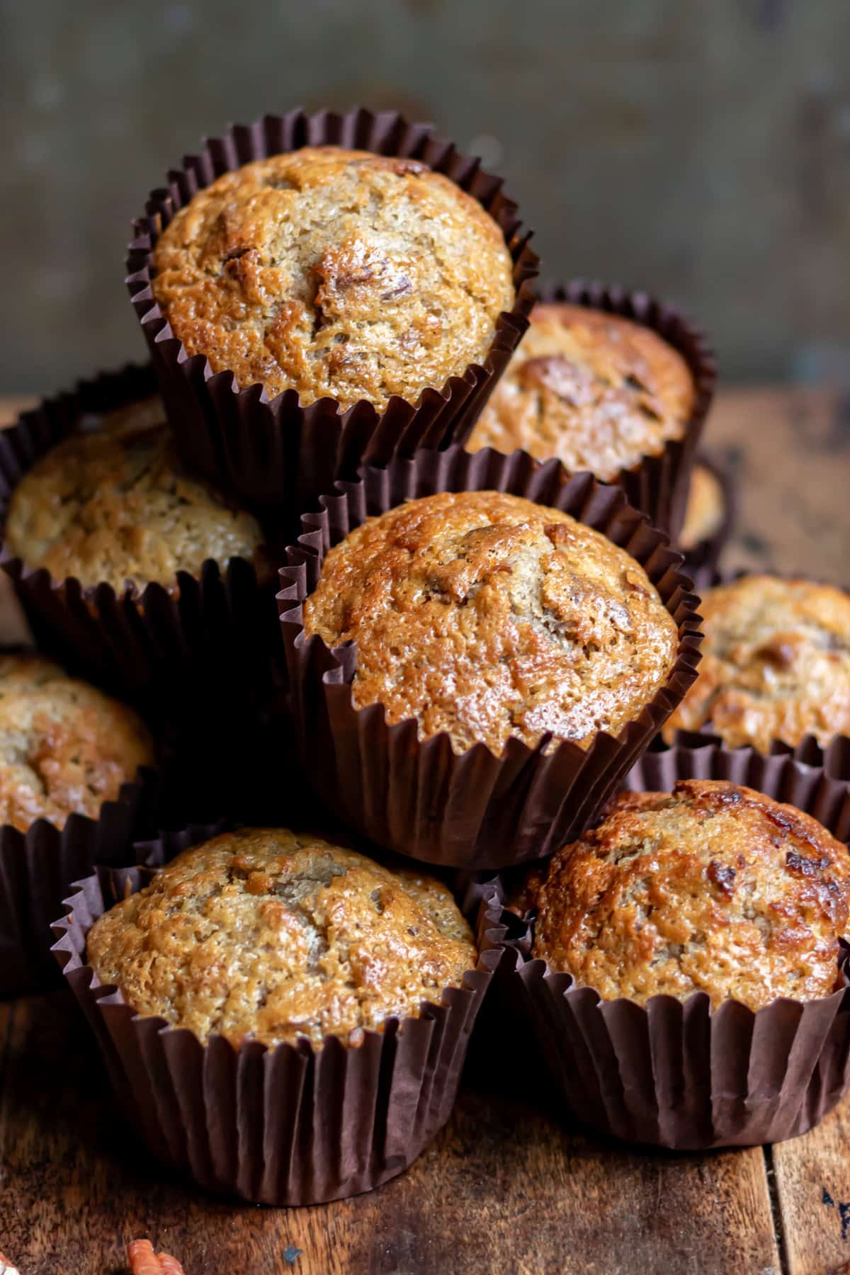 Close up of a stack of pecan date muffins.