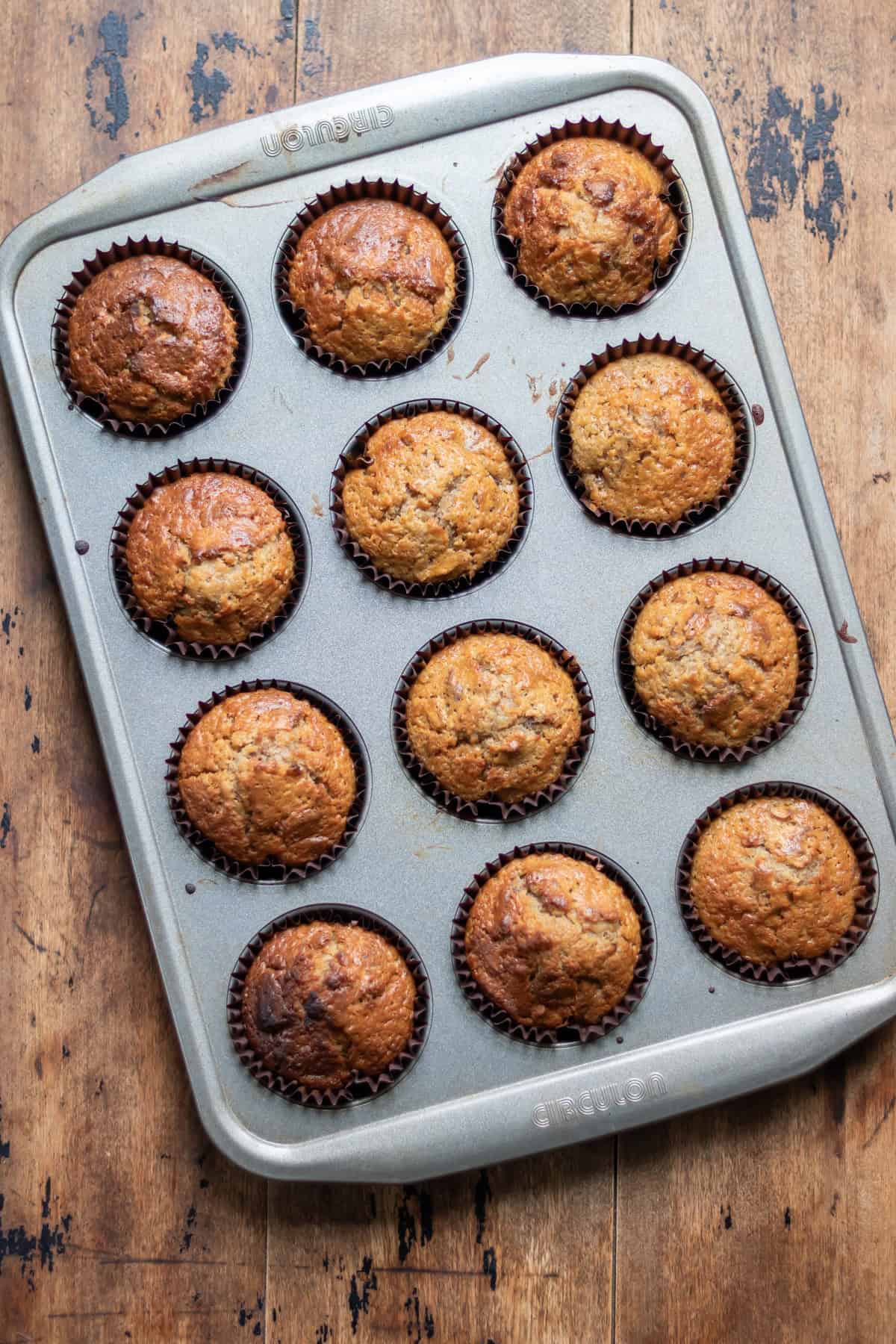 Baked pecan date muffins in the muffin tray.