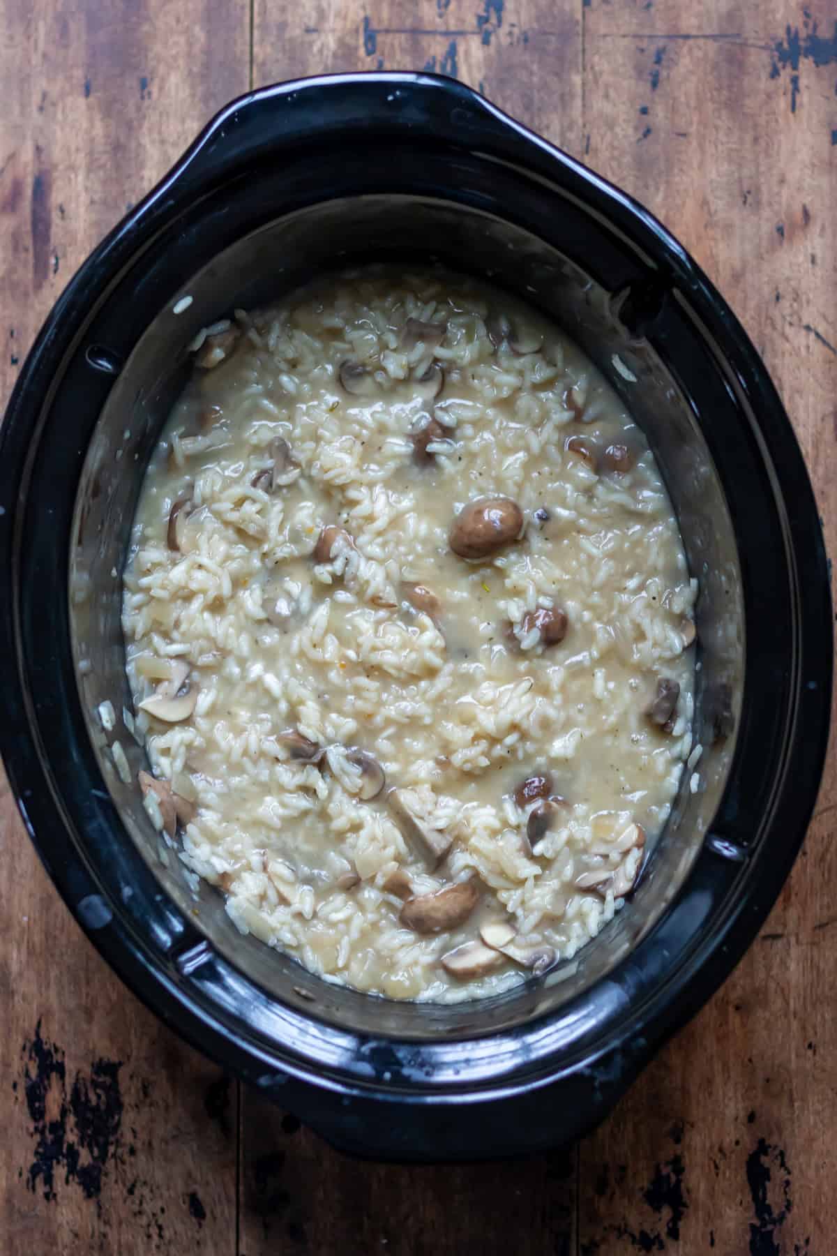 Partially cooked slow cooker mushroom risotto.