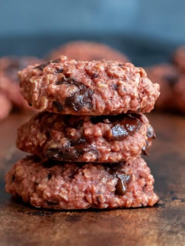 A stack of three chocolate chunks beetroot cookies.