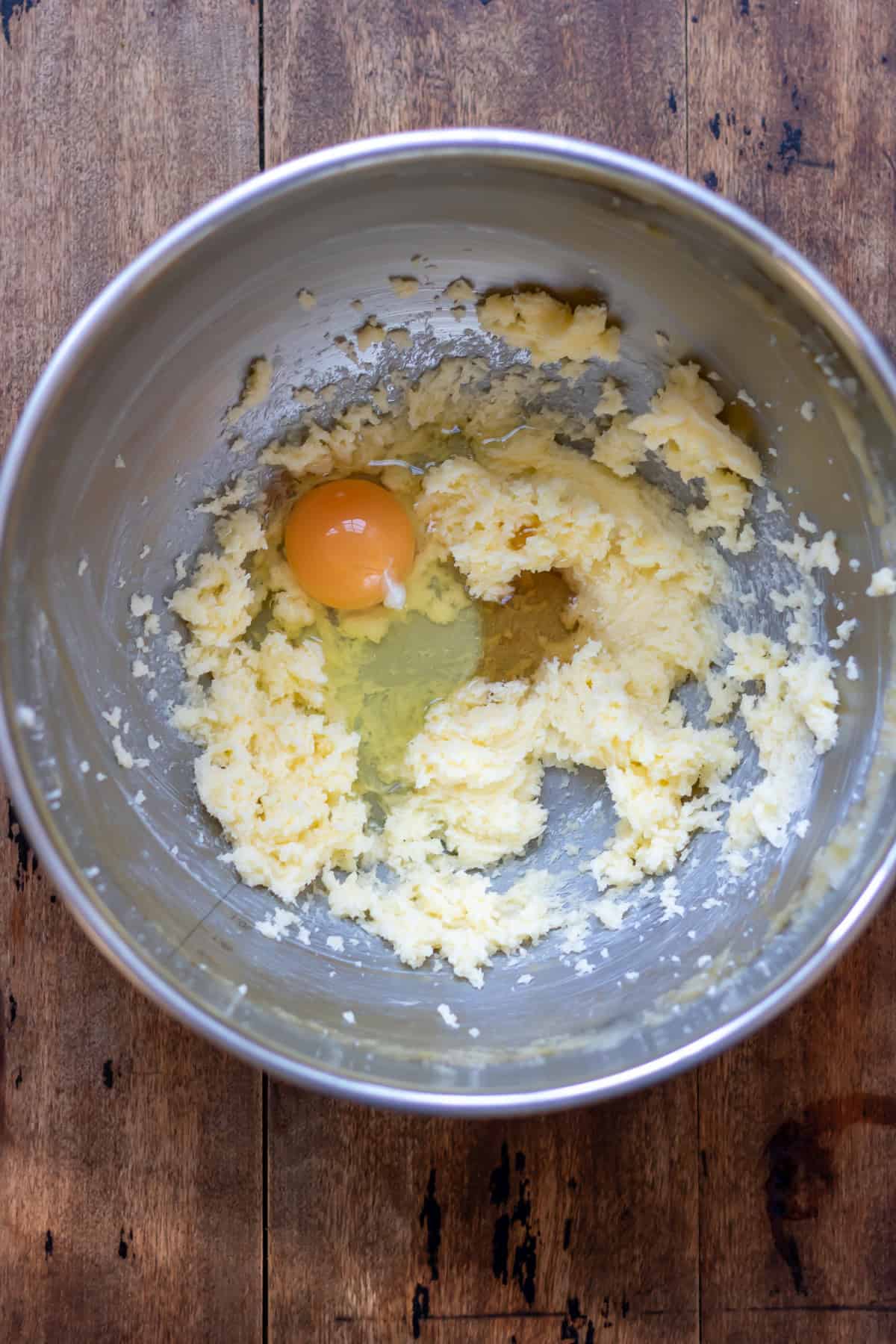 Egg and vanilla added to the creamed butter and sugar.