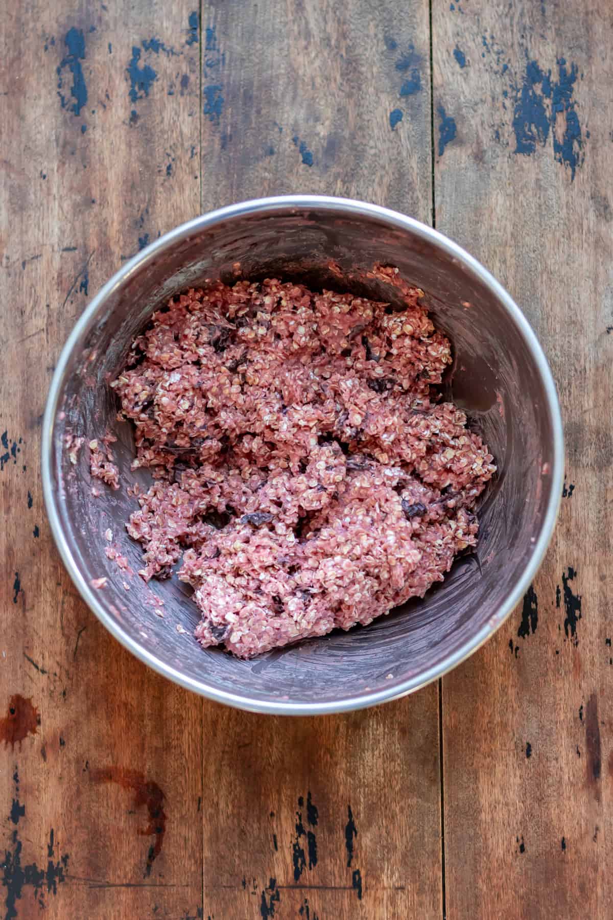 Chocolate chunk beetroot cookies batter mixed in a bowl.