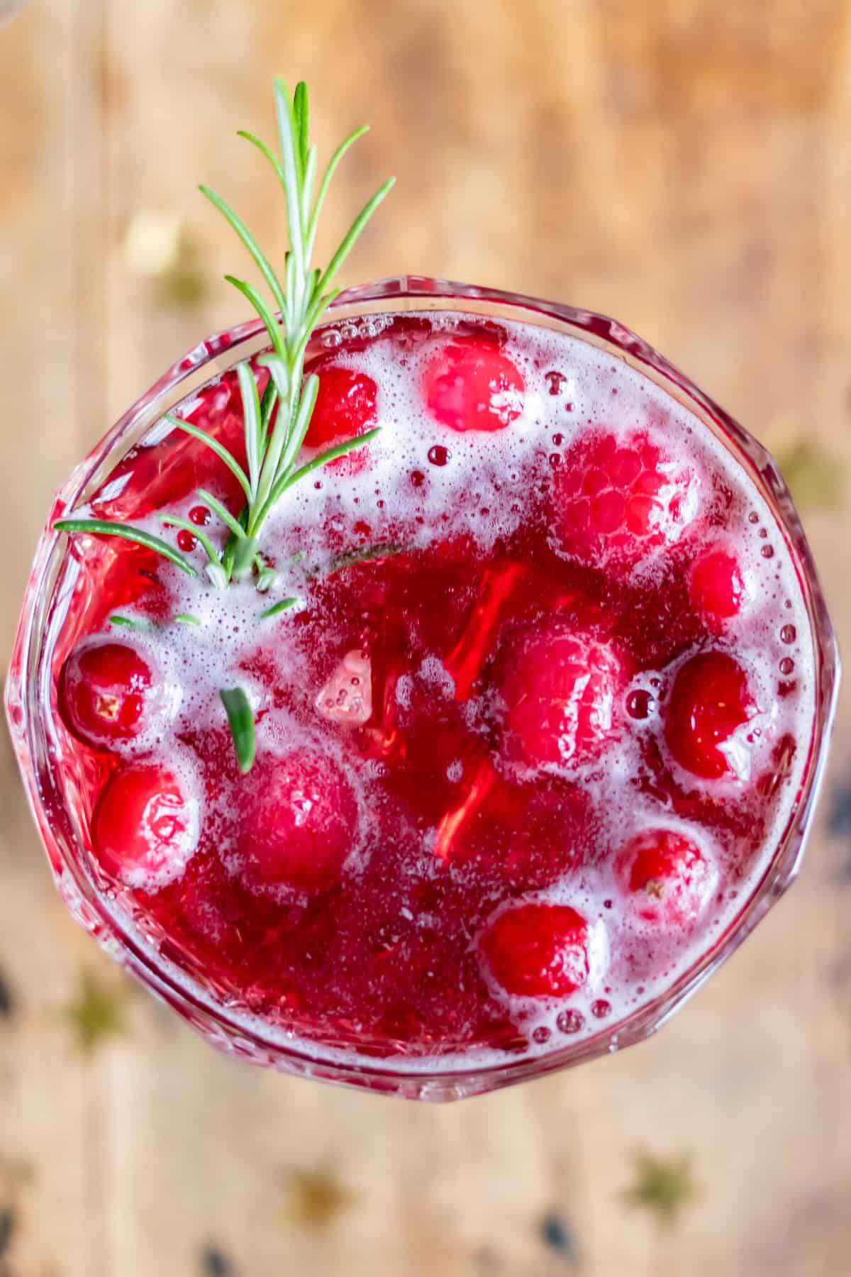 Looking down at a chilled glass of mulled wine spritzer.